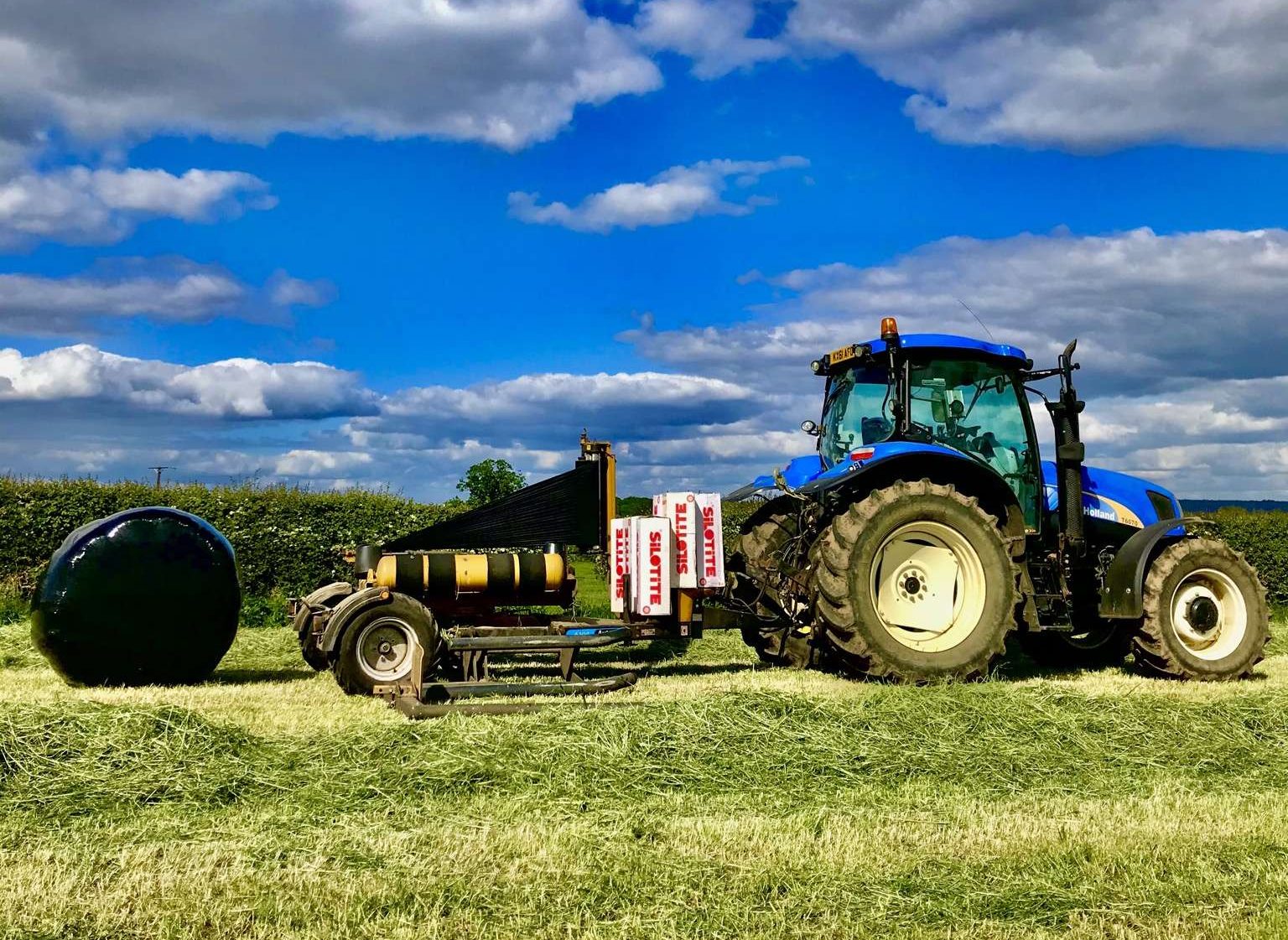 tractor making bales of silage